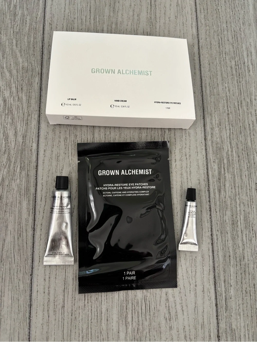Grown Alchemist travel mini trio lip balm hand cream eye patches. New and sealed